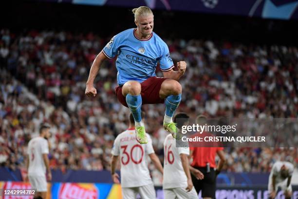 Manchester City's Norwegian striker Erling Haaland celebrates after scoring his team's third goal during the UEFA Champions League Group G first-leg...