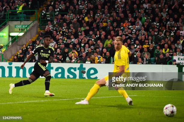 Real Madrid's Brazilian forward Vinicius Junior scores his team first goal during the UEFA Champions League Group F football match between Celtic and...