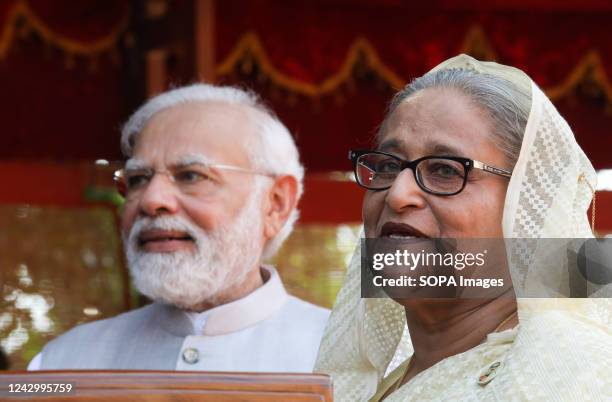 Bangladesh Prime Minister Sheikh Hasina speaks to the media during the ceremonial reception with Narendra Modi standing nearby at the Rashtrapati...