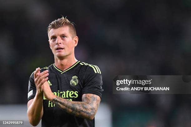 Real Madrid's German midfielder Toni Kroos celebrates at the end the UEFA Champions League Group F football match between Celtic and Real Madrid, at...