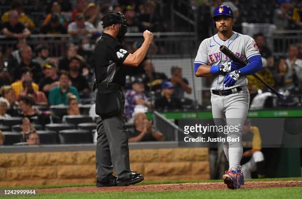 Eduardo Escobar of the New York Mets walks back to the dugout after striking out swinging in the seventh inning during the game against the...
