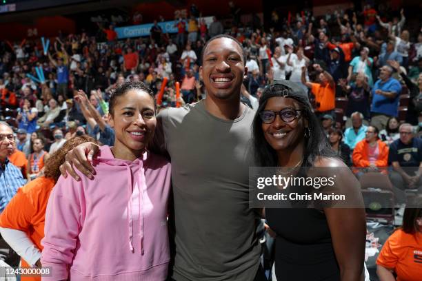 Former professional basketball players Allison Feaster and Ashley Battle pose for a portrait with Grant Williams of the Boston Celtics during Round 2...