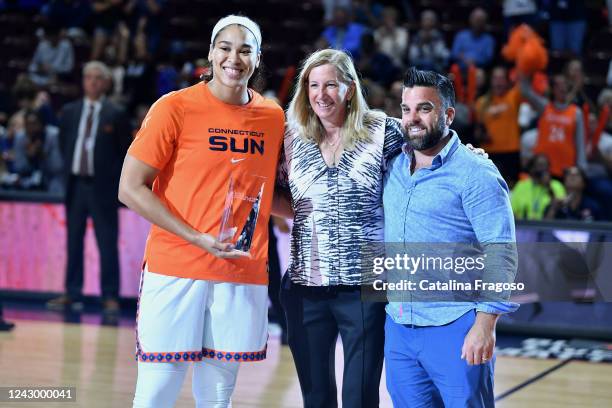 Brionna Jones of the Connecticut Sun is presented with the KIA Sixth Player of the Year Award by WNBA Commissioner Cathy Engelbert during Round 2...