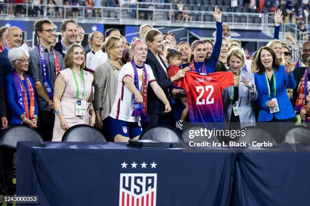 Members of U.S. Soccer and the U.S. Women's National Team Players Association hold up an Equal Pay jersey after signing a collective bargaining...