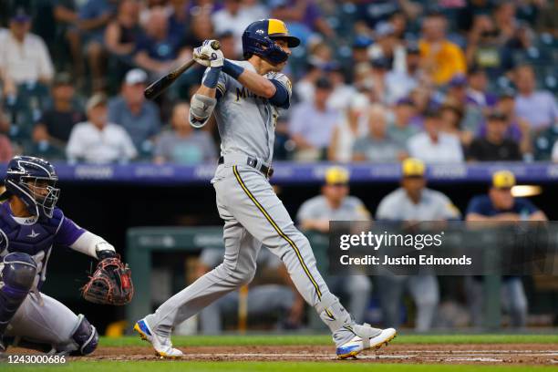 Christian Yelich of the Milwaukee Brewers hits a single in the third inning against the Colorado Rockies at Coors Field on September 6, 2022 in...