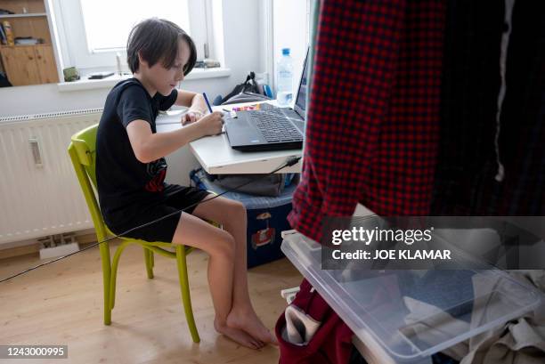 Ukrainian boy Danylo Titkov takes online Ukrainian studies in his room in Vienna, Austria on September 2, 2022. After months of anguish and...