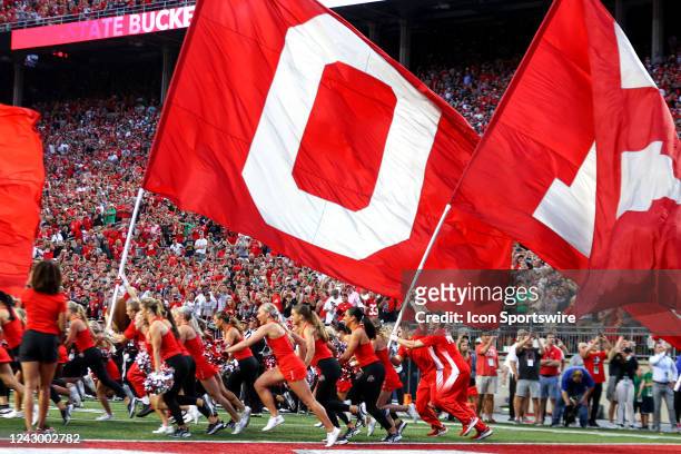 The Ohio State Buckeyes cheerleaders and dance team lead the Buckeyes on to the field prior to the college football game between the Notre Dame...