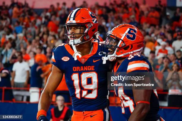 Syracuse Orange Running Back Sean Tucker congratulates Syracuse Orange Wide Receiver Oronde Gadsden II for scoring a touchdown during the second half...