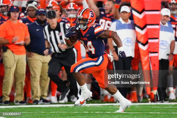 Syracuse Orange Running Back Sean Tucker runs with the ball during the first half of the college football game between the Louisville Cardinals and...