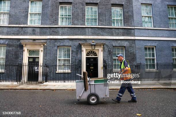 Road sweeper pushes a cart outside 10 Downing Street in London, UK, on Wednesday, Sept. 7, 2022. Liz Truss promised a major package of support this...