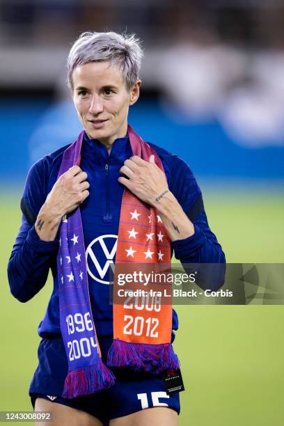 Megan Rapinoe of United States wears an Equal Pay scarf with the years that the United States won gold medals in the Olympics and waits for the...