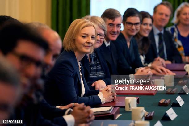 Britain's Prime Minister Liz Truss poses with members of her new Cabinet inside 10 Downing Street in central London on September 7, 2022. - Britain's...