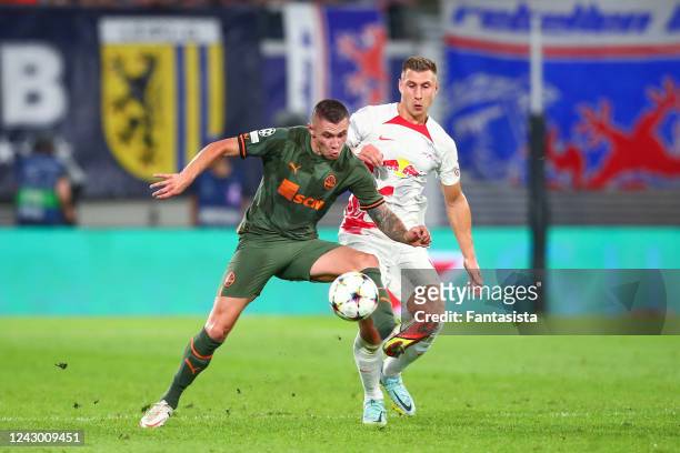 Willi Orban of RB Leipzig in action with Oleksandr Zubkov of Shakhtar during the UEFA Champions League Group F match between RB Leipzig and Shakhtar...