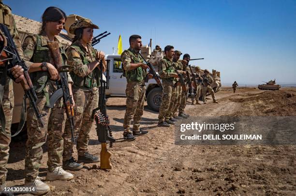 Fighters of the Syrian Democratic Forces attend a joint military exercise with forces of the US-led "Combined Joint Task Force-Operation Inherent...