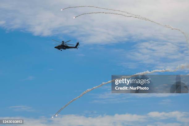 Apache helicopter fires flares while maneuvering during the 2-day live-fire drill, amid intensifying threats military from China, in Pingtung county,...