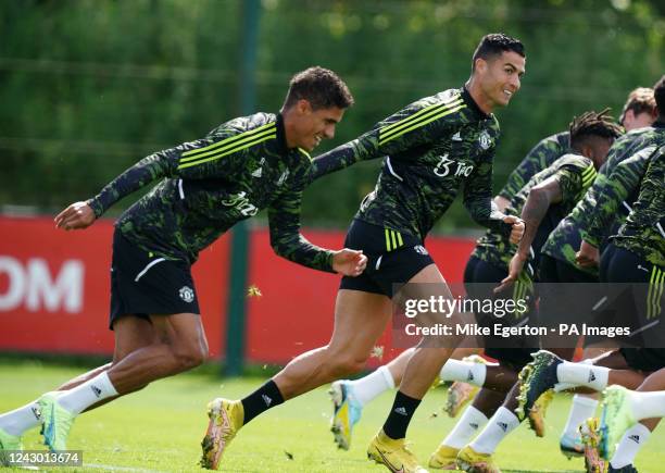 Manchester United's Raphael Varane and Cristiano Ronaldo during the training session at the Aon Training Complex, Greater Manchester. Picture date:...