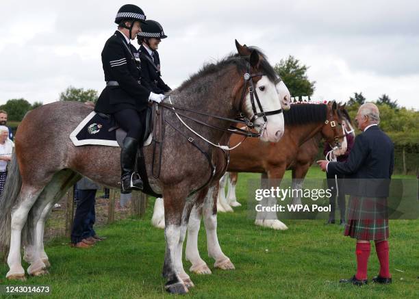 Prince Charles, Prince of Wales, known as the Duke of Rothesay while in Scotland, and Patron of the Clydesdale Horse Society, with police horses...