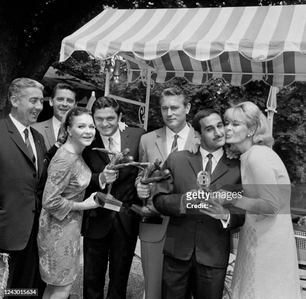 French singer and actress Line Renaud and French television presenter Jacqueline Huet award with the Trophées UNFP du football, previously called...