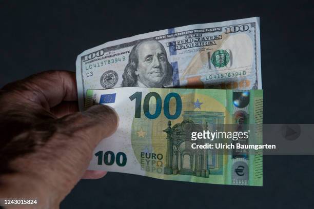 This photo illustration shows a one hundred dollar and a one hundred Euro banknote on September 07, 2022 in Bonn, Germany. The still uncertain supply...