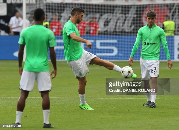 Sporting players including Portuguese forward Paulinho and Spanish defender Jose Martinez Marsa warm up prior to the UEFA Champions League Group D...