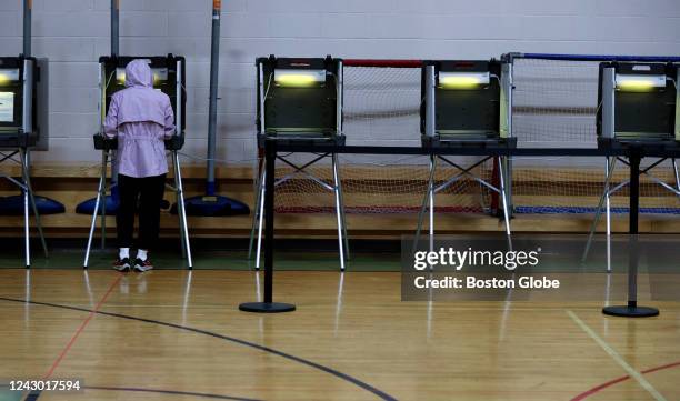 Brookline, MA An early morning voter fills our her ballot on Primary Day, at the Lincoln School polling place