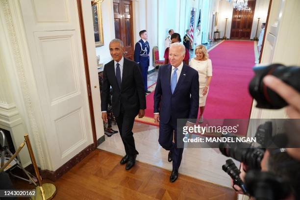 President Joe Biden and First Lady Jill Biden along with former president Barack Obama and wife Michelle Obama arrive to take part in the unveiling...