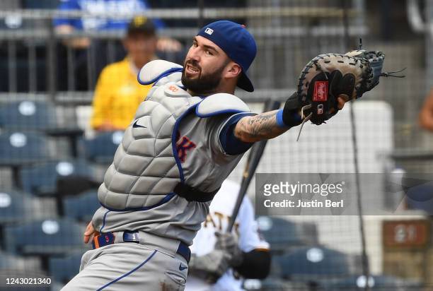 Tomas Nido of the New York Mets catches a foul pop out off the bat of Oneil Cruz of the Pittsburgh Pirates in the sixth inning during Game One of a...