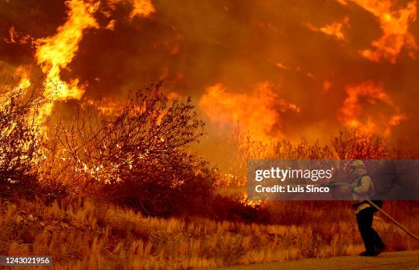 Firefighter battles the Fairview fire along Batista Road near Hemet on Tuesday, Sep. 6, 2022.