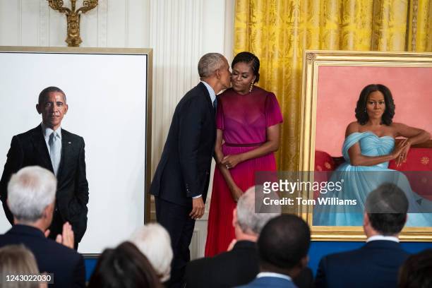 Former President Barack Obama and former First Lady Michelle Obama view their official White House portraits during an unveiling ceremony in the East...