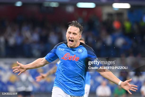 Napoli's Polish midfielder Piotr Zielinski celebrates after scoring a penalty kick during the UEFA Champions League Group A first leg football match...