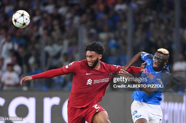 Liverpool's English defender Joe Gomez fights for the ball with Napoli's Nigerian forward Victor Osimhen during the UEFA Champions League Group A...