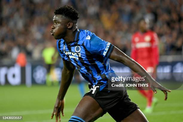 Club Brugge's defender Abakar Sylla celebrates after scoring a goal during the UEFA Champions League group stage football match between Bruges and...