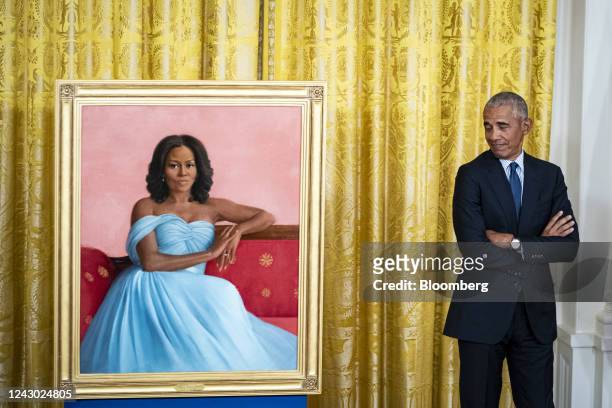 Former US President Barack Obama stands next to the official White House portrait for former US First Lady Michelle Obama during an unveiling...