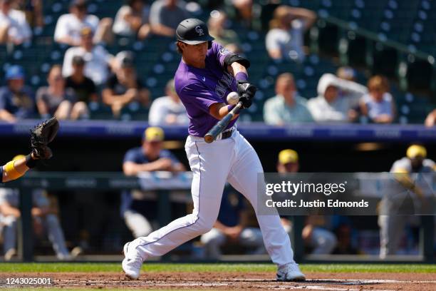 Michael Toglia of the Colorado Rockies hits an RBI triple in the second inning against the Milwaukee Brewers at Coors Field on September 7, 2022 in...