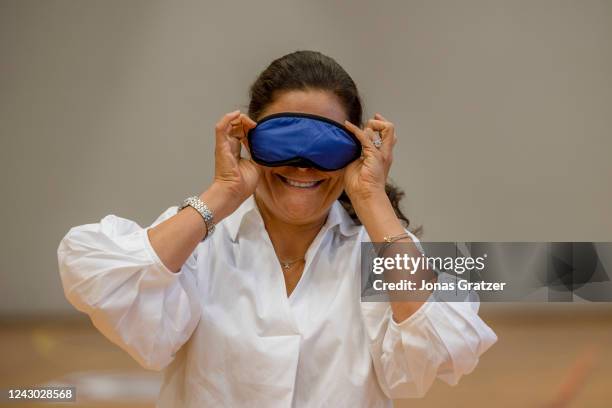 Princess Victoria of Sweden participates in sport activities with 9th graders in the gymnastics hall at Steningehojden's School during a visit by the...