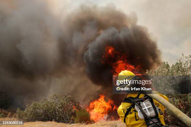 Hemet, CA A firefighter attacks on brush fire on third day of Fairview Fire along in Bautista Canyon Road on Wednesday, Sept. 7, 2022 in Hemet, CA.