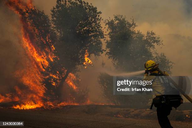 Hemet, CA A firefighter attacks on brush fire on third day of Fairview Fire along in Bautista Canyon Road on Wednesday, Sept. 7, 2022 in Hemet, CA.