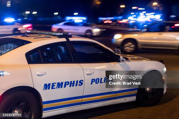 Police investigate the scene of a reported carjacking reportedly connected to a series of shootings on September 7, 2022 in Memphis, Tennessee....