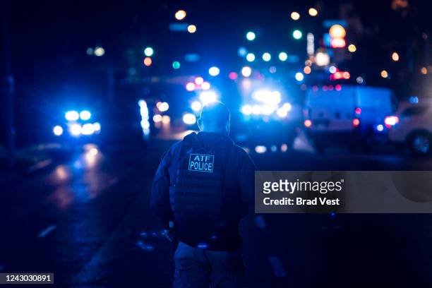 Police investigate the scene of a reported carjacking reportedly connected to a series of shootings on September 7, 2022 in Memphis, Tennessee....