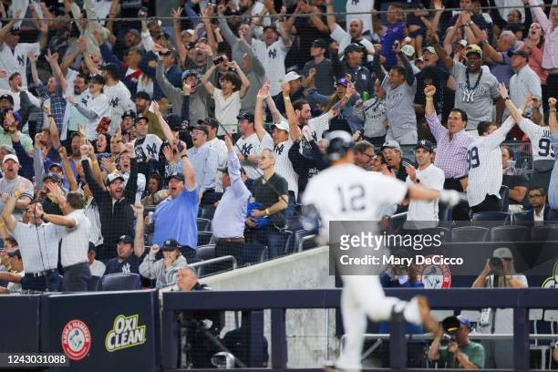 Fans react to Isiah Kiner-Falefa of the New York Yankees hitting a grand slam in the fourth inning during the game between the Minnesota Twins and...
