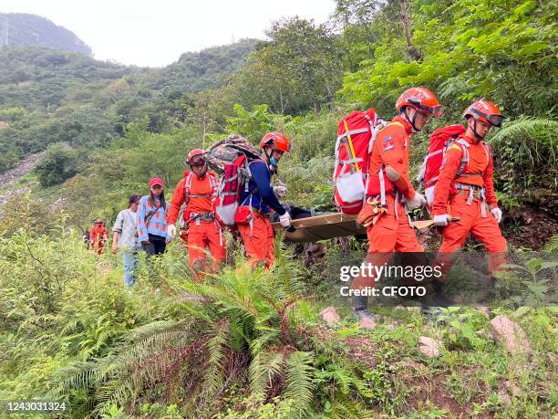 Rescuers transfer the injured and sick in Luding county, Sichuan Province, China, Sept 7, 2022. As of press time, the death toll from the Luding...