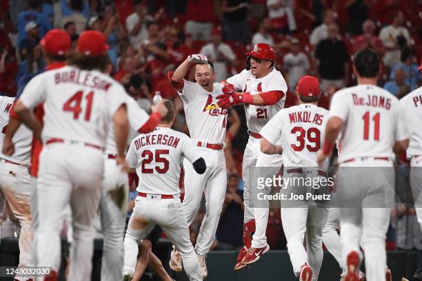 Tommy Edman of the St. Louis Cardinals celebrates with teammates after hitting a walk-off two-run double against the Washington Nationals at Busch...
