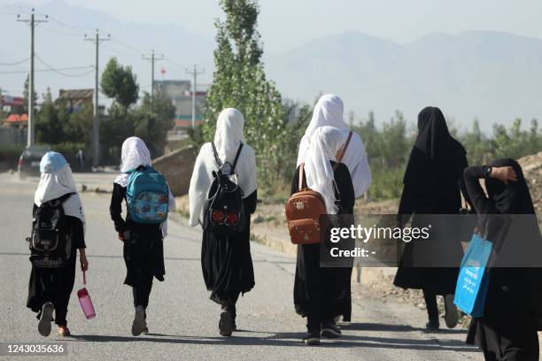 Girls walk to their school along a road in Gardez, Paktia porvince, on September 8, 2022. - Five government secondary schools for girls have resumed...