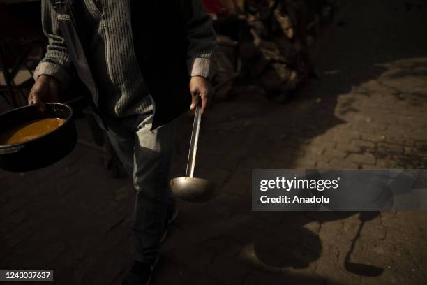 Alberto, a worker at the Casa del Pueblo soup kitchen makes preparations to receive people who come in search of food in Buenos Aires, Argentina on...