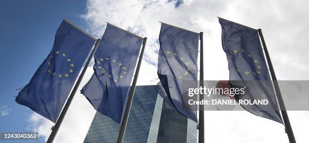 Flags of Europe flutter in front of the headquarters of the European Central Bank prior to the news conference of the bank's governing council...