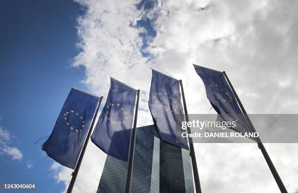 Flags of Europe flutter in front of the headquarters of the European Central Bank prior to the news conference of the bank's governing council...