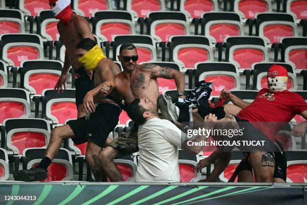 Cologne and Nice's supporters fight ahead of the UEFA Europa Conference League football match between Nice and FC Cologne at the Allianz Riviera in...