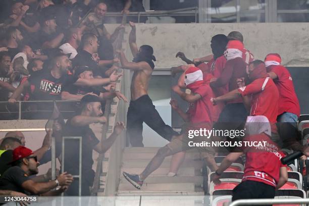 Cologne and Nice's supporters fight ahead of the UEFA Europa Conference League football match between Nice and FC Cologne at the Allianz Riviera in...
