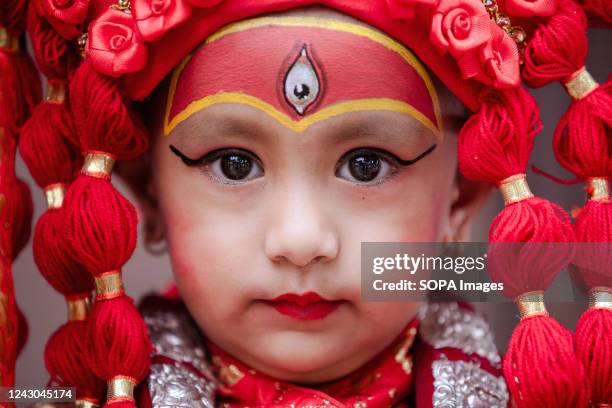 Young girl dressed as the Living Goddess Kumari takes part in the Kumari Puja festival at Hanuman Dhoka, Kathmandu Durbar Square. The annual...
