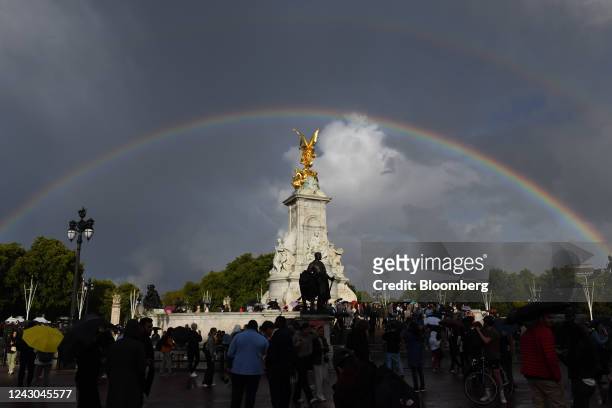Tourist gather near a double rainbow over Queen Victoria Memorial outside Buckingham Palace in London, UK, on Thursday, Sept. 8, 2022. The doctors...